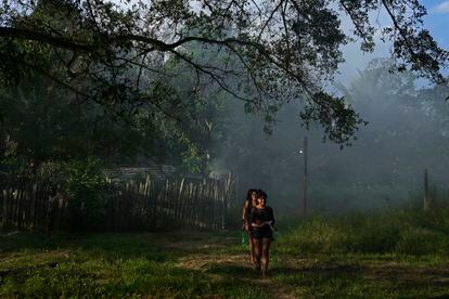 A group of young people walk in an Amazonian village in the State of Pará (Brazil).