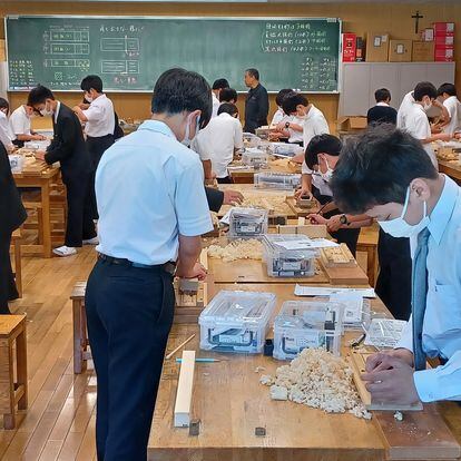 Students at the Seiko Gakuin High School in Yokohama, Japan, during a crafts class where they learn how to make wooden chopsticks.
