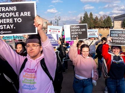 People march around the Nebraska state Capitol during a Transgender Day of Visibility rally, on March 31, 2023, in Lincoln, Nebraska.