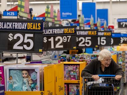 Black Friday deals line the aisles as shoppers look for bargains at a Walmart Supercenter in Burbank (California), on November 14, 2023.