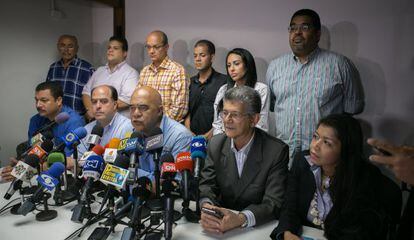 MUD secretary general Jesús Torrealba (center) during a news conference.