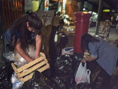 Trash-pickers search through garbage in Buenos Aires in 2008.