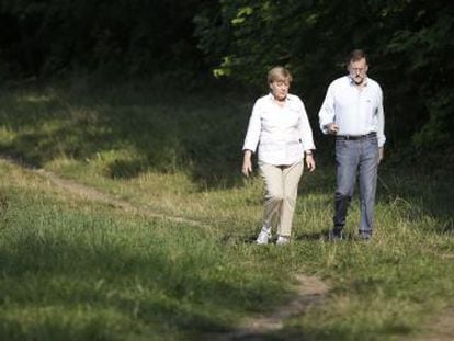 Angela Merkel with Mariano Rajoy in Berlin on Monday.