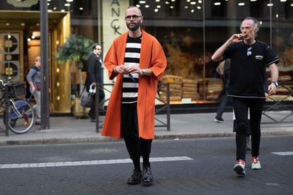 Fashion critic Angelo Flaccavento, wearing an Issey Miyake Homme Plissé coat and pants during Paris Fashion Week in September 2018.