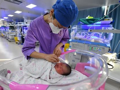 A nurse attends to a newborn at a hospital in Fuyang, China.