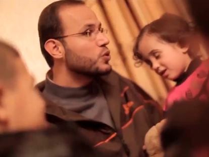 Refaat Alareer is pictured with his family in a report by Al Jazeera TV
