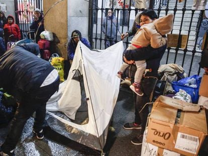 Asylum seekers lining up outside a social services building in Madrid.