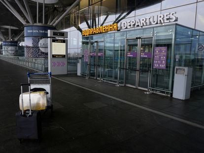 Luggage is left abandoned in the departure terminal of Boryspil International Airport, in Kyiv, following the invasion of Ukraine by Russia, on February 24, 2022.