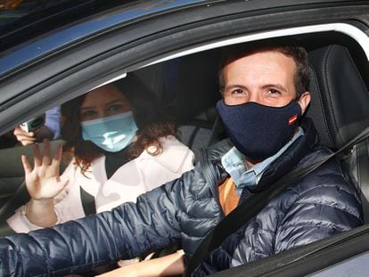 Popular Party president Pablo Casado at the wheel of his car during the Madrid protest. With him is Madrid regional premier Isabel Díaz Ayuso, and Madrid Mayor José Luis Martínez-Almeida.