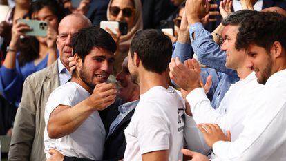 Carlos Alcaraz celebrates with family after beating Novak Djokovic.