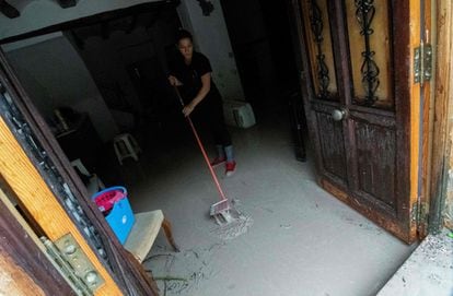 A women mops up in her house in Ontinyent (Valencia) after the River Clariano burst its banks on Thursday.