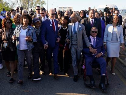 President Joe Biden talks with Rep. Terri Sewell, D-Ala., center, and the Rev. Al Sharpton after walking across the Edmund Pettus Bridge in Selma, Ala., Sunday, March 5, 2023, to commemorate the 58th anniversary of "Bloody Sunday," a landmark event of the civil rights movement. Sharpton holds hands with the Rev. Jesse Jackson at right. (AP Photo/Patrick Semansky)