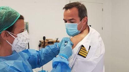 A crew member of the Spanish assault ship ‘Castilla’ receiving the Covid-19 vaccine.
