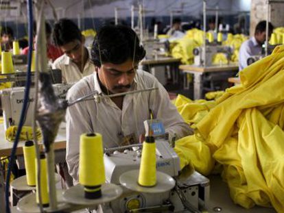 Factory workers create clothing for Pull&Bear in Pakistan.