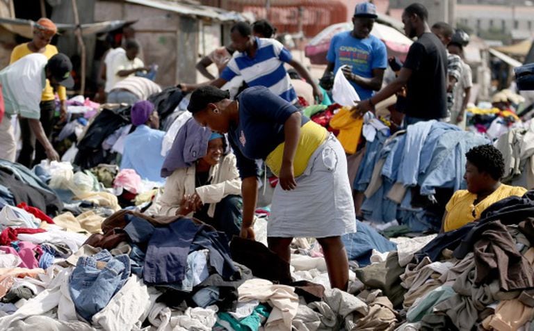 Haitians buy clothes at a street market on Sunday.
