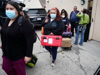 Los Angeles County Public Health Emergency Operations officials leave St. Anthony's Croatian Catholic Church after evaluating the newly arrived migrants being housed in Los Angeles on Wednesday, June 14, 2023.