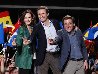 The PP’s Madrid regional candidate Isabel Díaz Ayuso, national chief Pablo Casado and Madrid mayoral candidate José Luis Martínez-Almeida celebrate their gains on Sunday night.