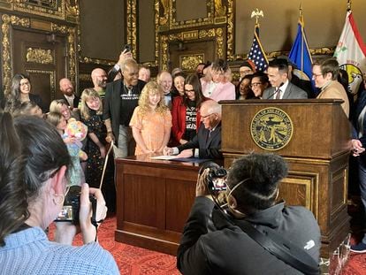 Minnesota Governor Tim Walz signs an executive order on March 8, 2023, at the State Capitol in St. Paul to protect the rights of LGBTQ people to receive gender-affirming health care.