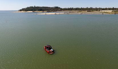 A boat floats in the Granite Bay area of Folsom Lake, in Granite Bay, Calif., on Sunday, March 26, 2023