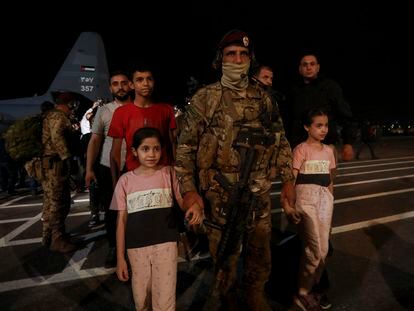 Jordanians evacuated from Sudan arrive at a military airport in Amman, Jordan, on April 24, 2023.