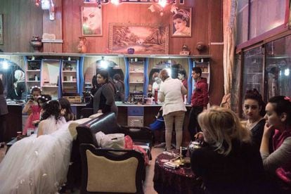Brides preparing for their wedding at at the Alestora beauty salon in Homs.