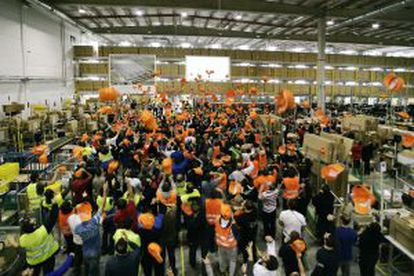Photo handed out by Amazon of employees in Madrid celebrating announcement of the company's expansion.