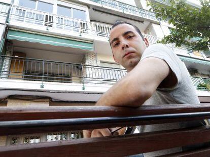Ernesto Soriano in front of the property in which he lives with his grandmother.