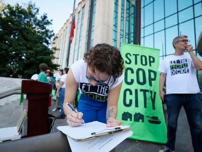 Activists gather outside Atlanta City Hall, Monday, Sept. 11, 2023, where they delivered dozens boxes full of signed petitions to force a referendum on the future of a planned police and firefighter training center