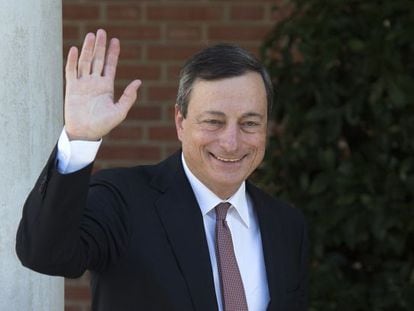 Mario Draghi waves before a meeting at La Moncloa prime ministerial palace in Madrid.