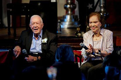 Former president Jimmy Carter and his wife, former first lady Rosalynn Carter, sit together during a reception to celebrate their 75th wedding anniversary in Plains, Georgia, U.S., in 2021.