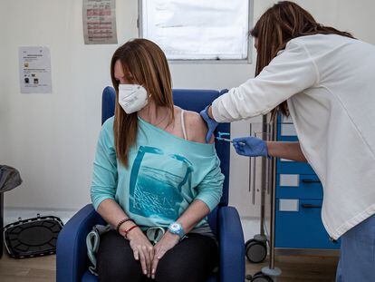 A health worker administering the Oxford-AstraZeneca vaccine in Valencia.