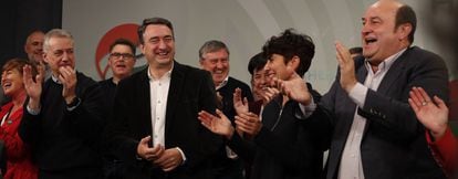 Basque Nationalist Party (PNV) deputy Aitor Esteban (second from the left), party leader Andoni Ortuzar (right) and Basque premier Iñigo Urkullu (left), celebrate the election results at the PNV headquarters in Bilbao.