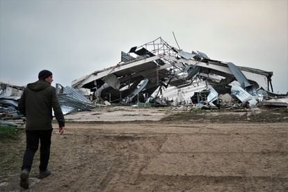 Sergei Yatsenko, manager of the Agrosvit farm in Shestakove, on November 11, in front of one of the stables destroyed by Russian shelling.