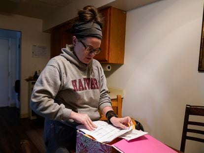 Samantha Richards looks over her Medicaid papers, Friday, June 9, 2023, in Bloomington, Ind.