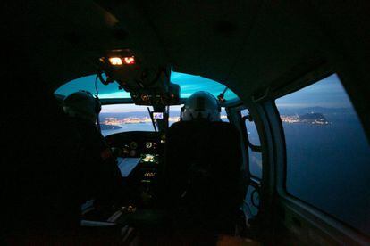 A helicopter used by customs officers takes off from a base at Los Barrios, close to Gibraltar, on one of several daily missions. Aboard are two pilots and two observers who use thermal cameras to watch for movement along the coast of Andalusia. When they detect a vessel they suspect is carrying drugs, they will give chase.