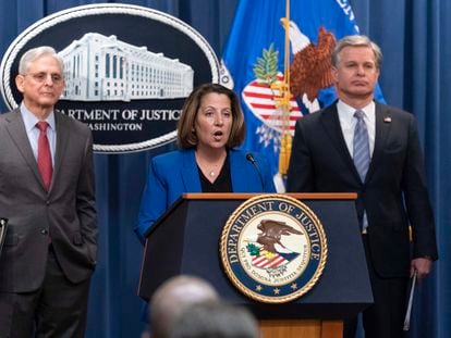 Deputy Attorney General Lisa Monaco flanked by Attorney General Merrick Garland, left, and Federal Bureau of Investigation (FBI) Director Christopher Wray speaks during a news conference to announce an international ransomware enforcement action, at the Department of Justice in Washington, Thursday, Jan. 26, 2023.