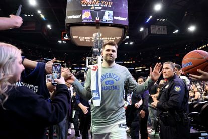 Luka Doncic leaves the court after defeating the Phoenix Suns at home.