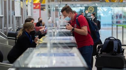 A passenger checks in at Madrid's Barajas Airport in March 2021.