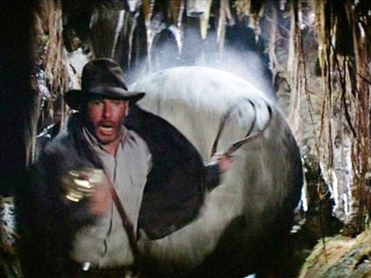 Image from ‘Raiders of the Lost Ark,’ in which Indiana Jones, with his trademark hat and whip, is running for his life from a huge stone ball.