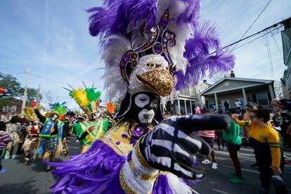 A member of the traditional Mardi Gras group The Trams marches on Mardi Gras Day in New Orleans, Tuesday, Feb. 21, 2023.