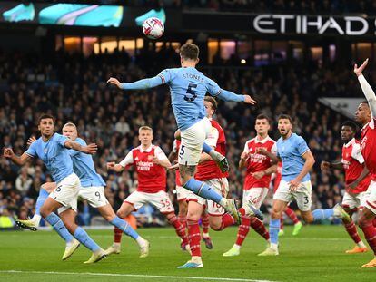 John Stones of Manchester City scores the team's second goal during the Premier League match between Manchester City and Arsenal FC at Etihad Stadium on April 26, 2023.