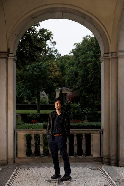 The Korean-born German thinker, standing just outside the chapel in the Old St. Matthew’s Cemetery, in Berlin.
