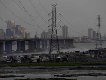 High tension power lines pass through Makoko slum in Lagos, Nigeria, Saturday, Aug. 20, 2022.
