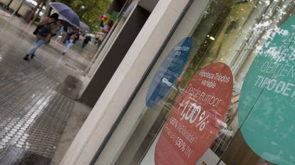 Mortgage advertisement in bank window.