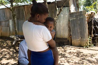 Yésica Prensa holds her youngest child, Dylan