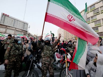Iran supporters celebrate their victory over Wales in the streets of Tehran.