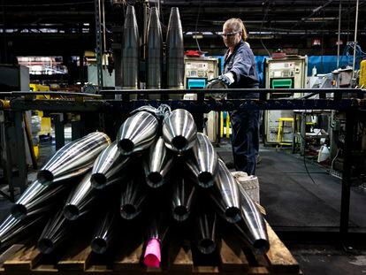 A steel worker moves a 155 mm M795 artillery projectile during the manufacturing process at the Scranton Army Ammunition Plant in Scranton, Pa., Thursday, April 13, 2023.
