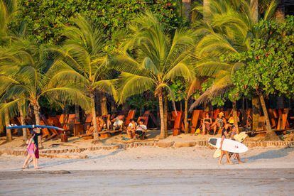 Surfers on the Avellana beach, in Gaunacaste province on the Pacific coast.