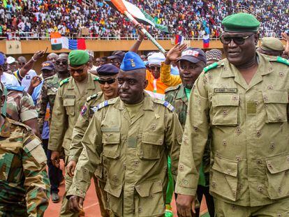 Members of a military council that staged a coup in Niger attend a rally at a stadium in Niamey, Niger, on August 6, 2023.