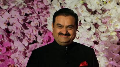 Gautam Adani poses during a wedding reception in Mumbai, India in 2019.